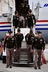 U.S. Army Soldiers with the Kansas City Recruiting Battalion carefully carry a secured document case down the steps of the “Freedom Plane” upon its arrival at the downtown airport, March 2, 2026. The Soldiers assisted with the ceremonial arrival and helped ensure the safe transfer of historic materials for transport to the museum for secure storage and display.