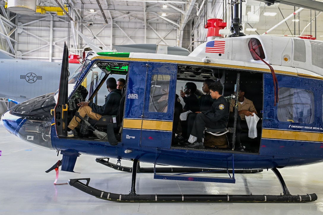 Students touring a helicopter.