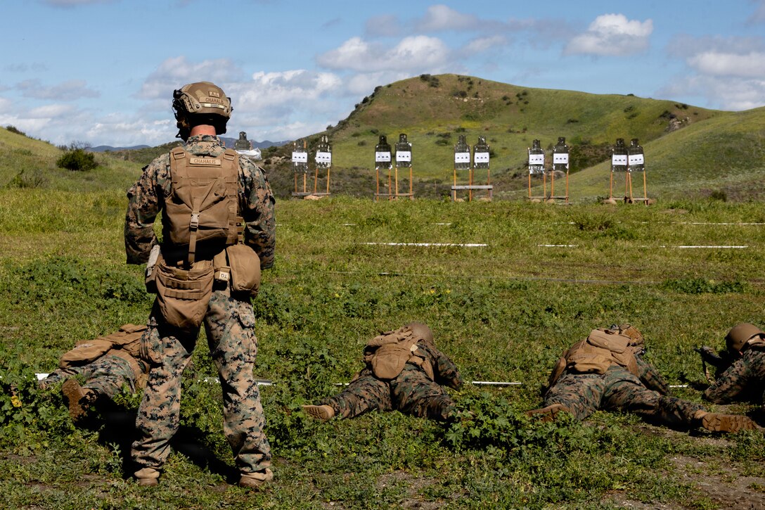 U.S. Marine Corps Sgt. Trevor Chahalis, a New Jersey native and communication chief with 1st Air Naval Gun Liaison Company, I Marine Expeditionary Force Information Group, observes Marines on the range during a basic skills training package at Marine Corps Base Camp Pendleton, California, Feb. 18, 2026. The basic skills package enhances the overall knowledge, readiness, and experiences of ANGLICO Marines and ensures the standards for combat skills, physical fitness, and unit proficiency are maintained. (U.S. Marine Corps photo by Lance Cpl. Theresa Lizarde)
