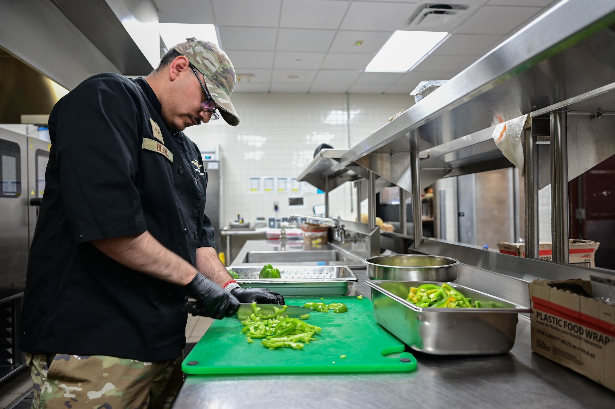 Man chops vegetables.
