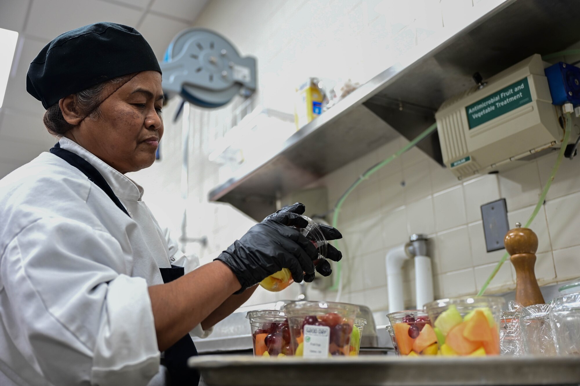 Woman washed fruit.
