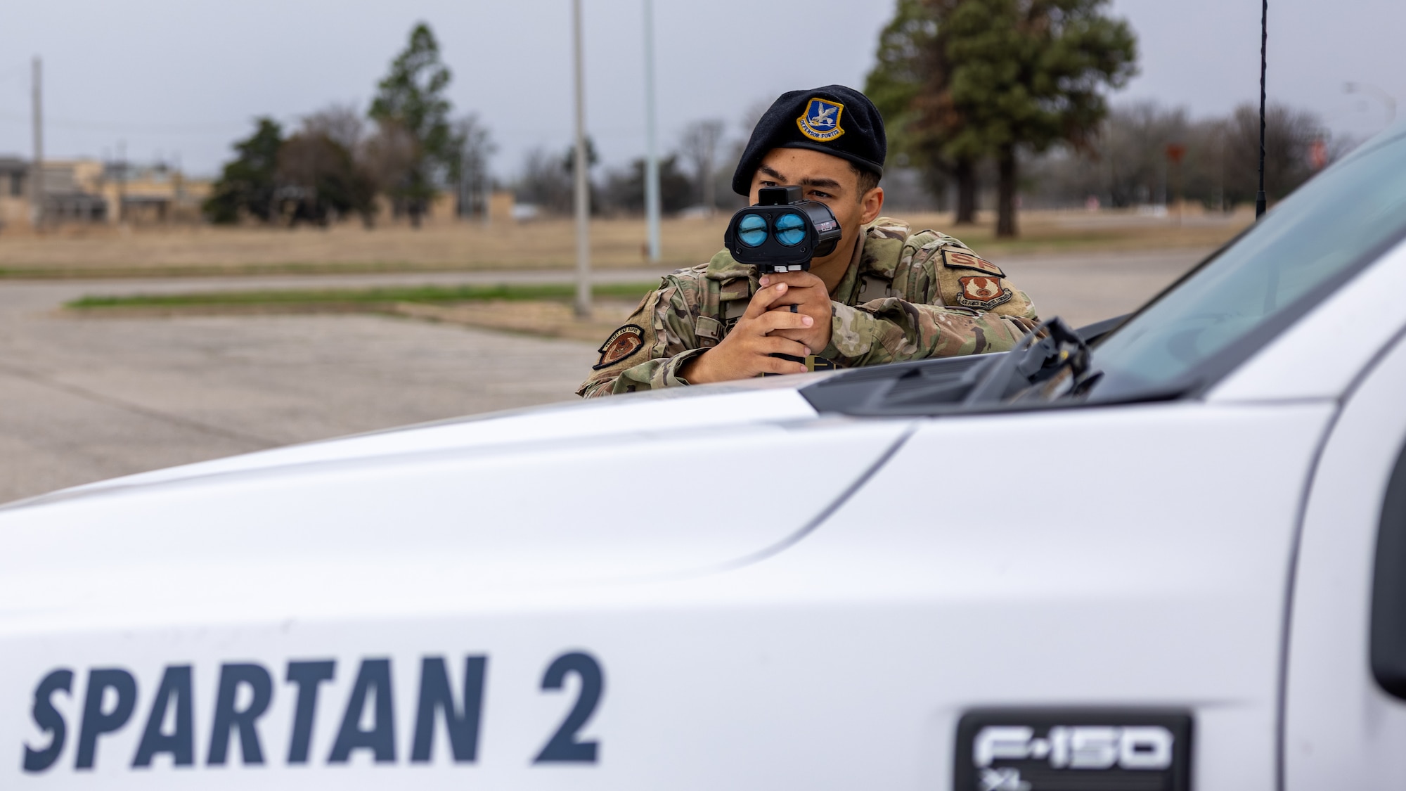 Man using radar on car.