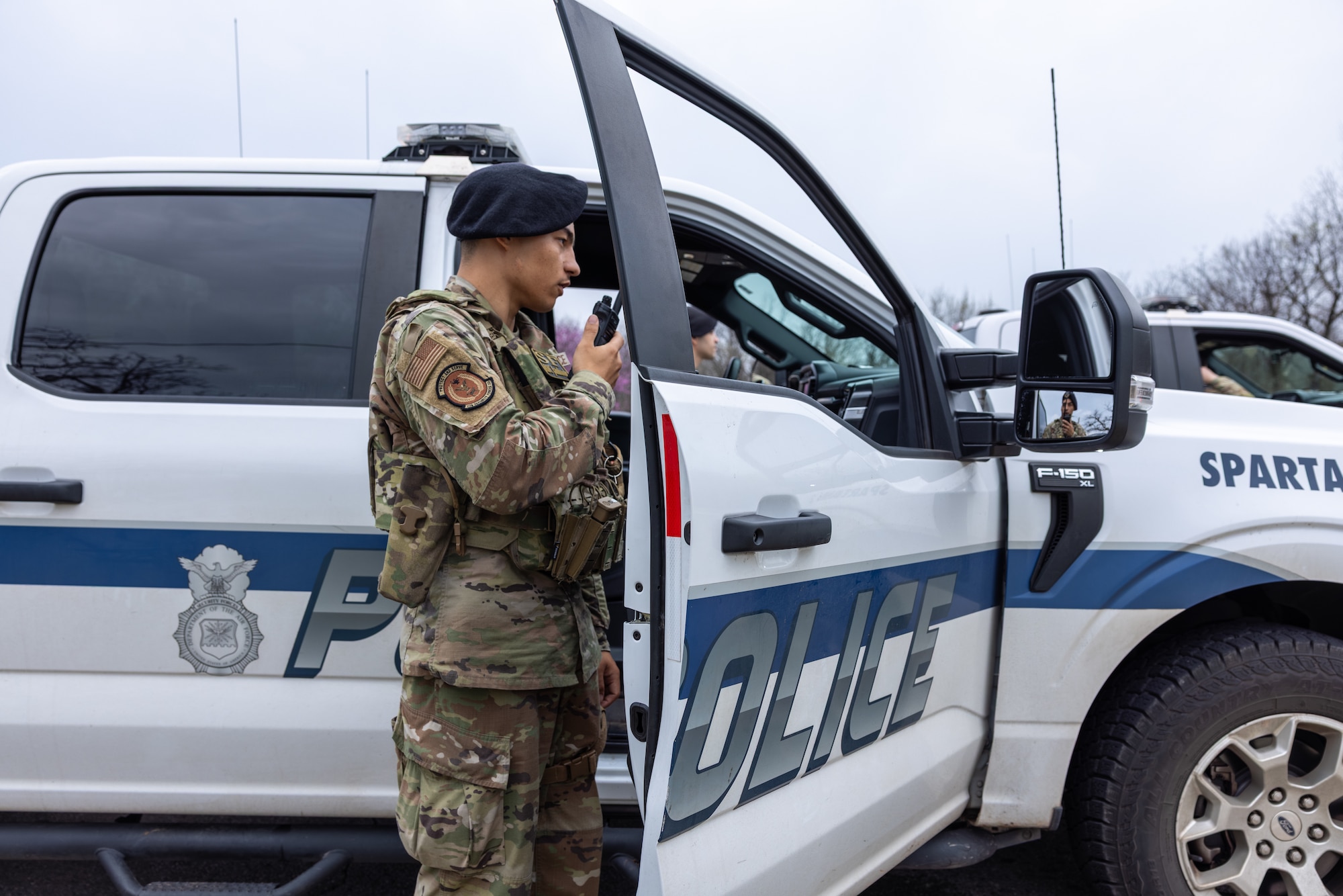 Man standing next to vehicle.