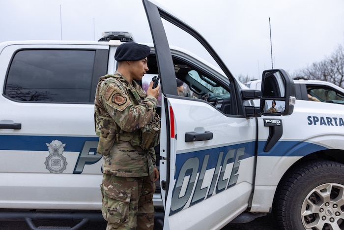 Man standing next to vehicle.