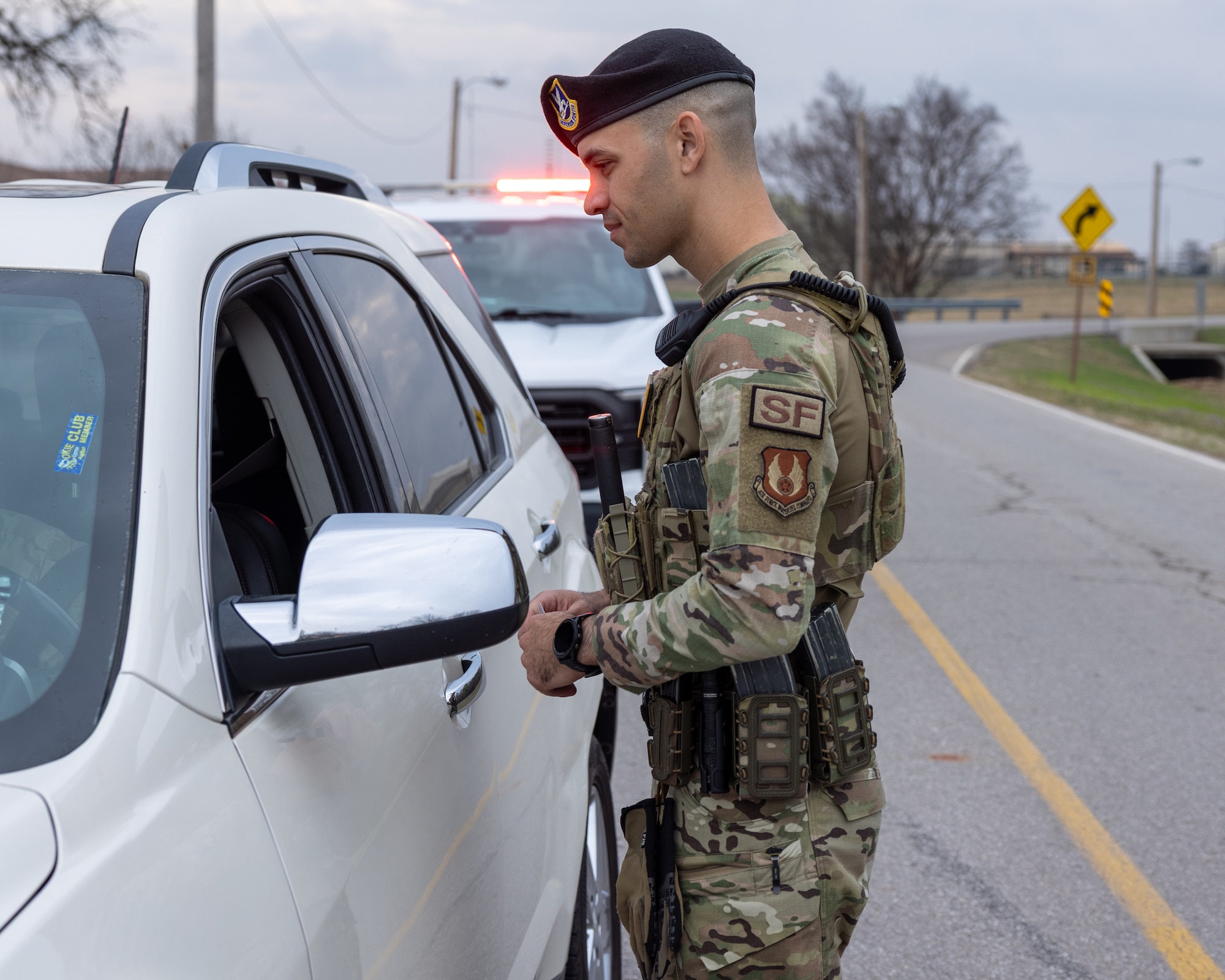 Man standing in front of vehicle.