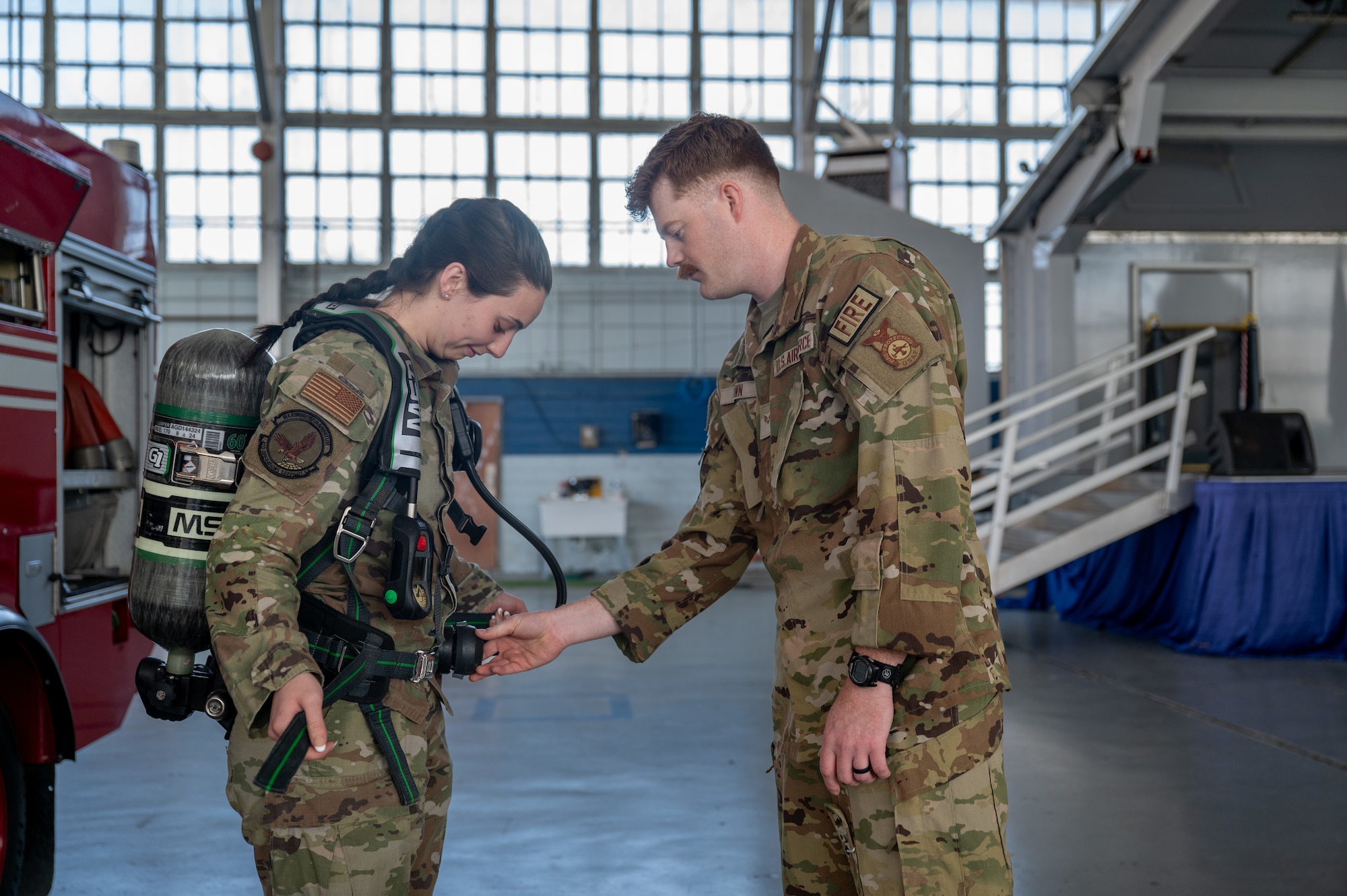 Maxwell Air Force Base Airmen participate in a gear demonstration in the honor guard hangar.