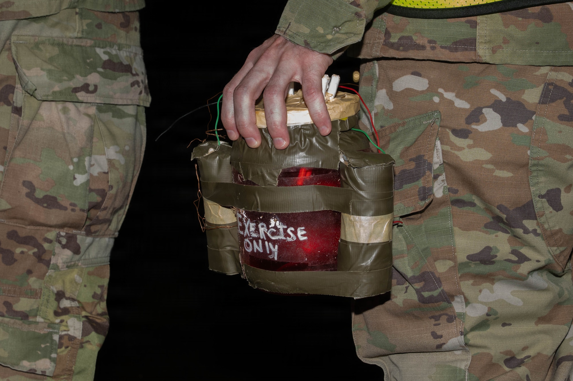 Airman simulating sweep after UXO.