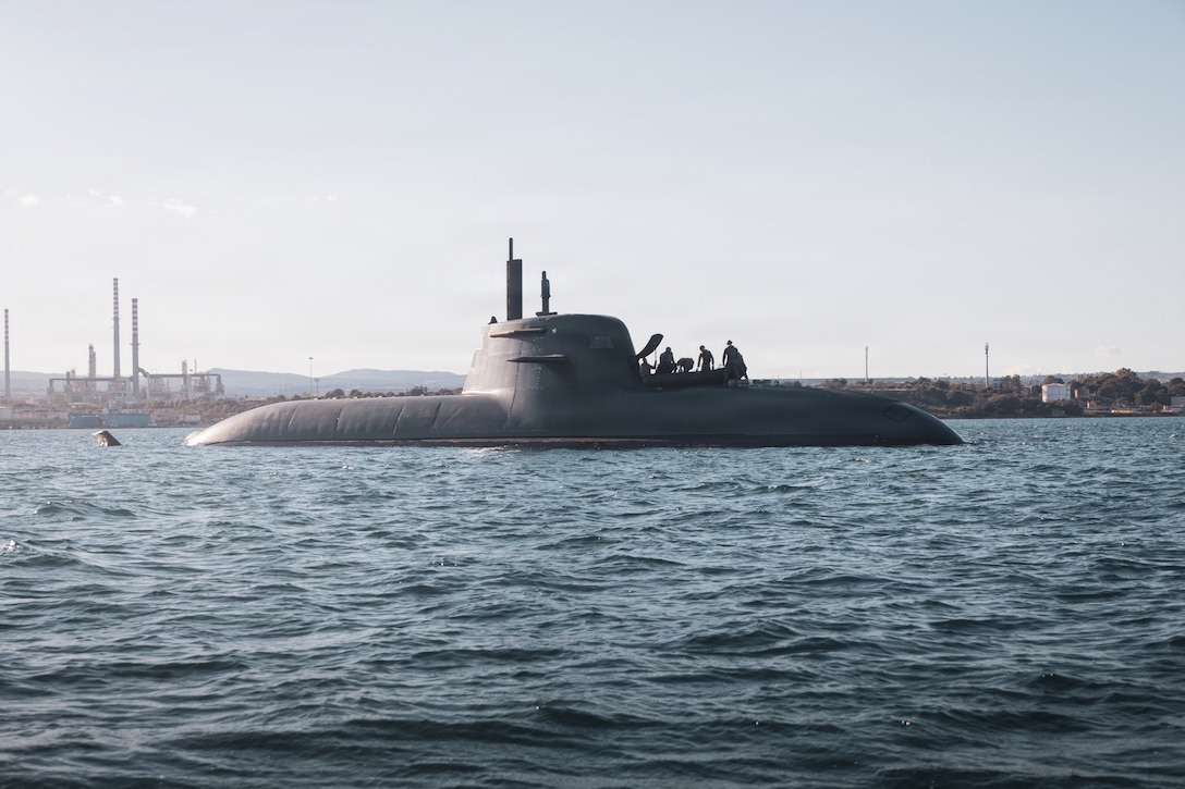 U.S. Marines and sailors with 2nd Force Reconnaissance Company, 2nd Reconnaissance Battalion, 2nd Marine Division, prepare a Combat Rubber Raiding Craft on a submarine off the coast of Augusta, Italy, Feb. 22, 2026. The Marines sailors prepared the CRRC during exercise Dynamic Manta 26. Dynamic Manta is a NATO-led exercise aimed to provide all participants with complex and challenging warfare training to enhance their interoperability and proficiency in anti-submarine and anti-surface warfare disciplines. (U.S. Marine Corps photo by Lance Cpl. Hunter J. Kuester)