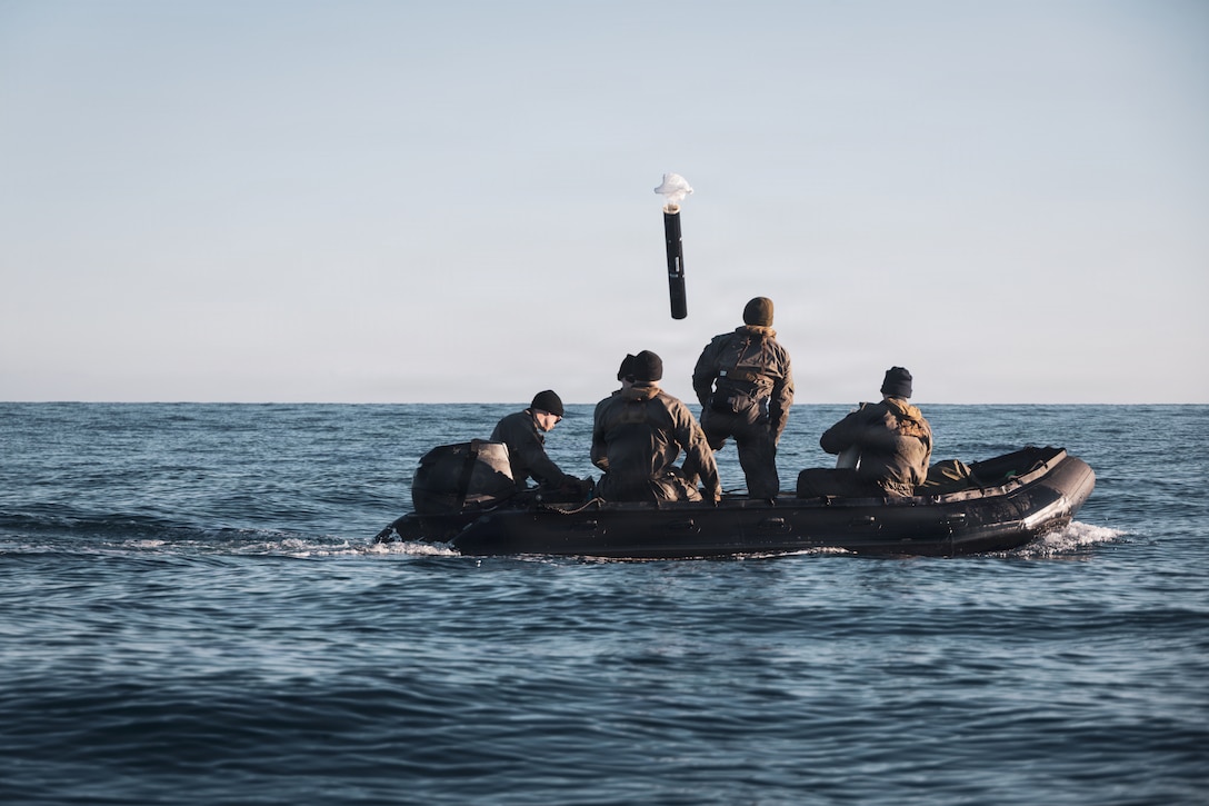 U.S. Marines and sailors with 2nd Force Reconnaissance Company, 2nd Reconnaissance Battalion, 2nd Marine Division, emplace a sonar buoy off the coast of Augusta, Italy, Feb. 24, 2026. The Marines and sailors emplaced the buoy during exercise Dynamic Manta 26. Dynamic Manta is a NATO lead exercise aimed to provide all participants with complex and challenging warfare training to enhance their interoperability and proficiency in anti-submarine and anti-surface warfare disciplines. (U.S. Marine Corps photo by Lance Cpl. Hunter J. Kuester)