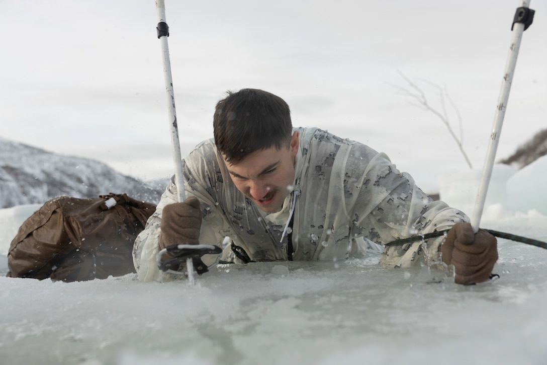 U.S. Marine Corps Sgt. Solomon Jackson, a motor vehicle operator with 2nd Distribution Support Battalion, Combat Logistics Regiment 27, 2nd Marine Logistics Group, participates in a cold plunge near Elvegardsmoen, Norway, March 10, 2026. The training taught Marines and Sailors how to manage the effects of cold-water submersion and perform active rewarming procedures during exercise Cold Response 26. A key component of NATO's enhanced vigilance activity Arctic Sentry, exercise Cold Response 26 is a Norwegian-led winter military exercise designed to enhance collective defense capabilities and ensure U.S. readiness to rapidly deploy and seamlessly operate alongside NATO Allies in challenging arctic conditions. Jackson is a native of Oregon. (U.S. Marine Corps photo by Lance Cpl. Franco Lewis)