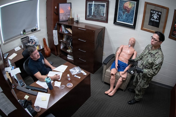 *Training* Hospital Corpsman Third Class Alexander Eshoo treats a simulated patient experiencing respiratory failure as Amanda Heath, a Fire Inspector and Emergency Medical Technician-Advanced, observes his performance during the testing portion of an Emergency Medical Technician-Basic course hosted by the MCAS Cherry Point Fire and Emergency Services Department on March 11, 2026.  Eshoo and other Sailors assigned to Navy Medicine Readiness and Training Command Cherry Point participated in the training to enhance their skills and knowledge in providing emergency medical care in various scenarios.