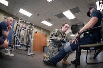 *Training* Hospitalman Johanna Myers, center, applies a pressure dressing to a simulated victim experiencing severe bleeding as Justin Oakley, a Firefighter Emergency Medical Technician, evaluates her performance during the testing portion of an Emergency Medical Technician-Basic course hosted by the MCAS Cherry Point Fire and Emergency Services Department on March 11, 2026.  Myers and other Sailors assigned to Navy Medicine Readiness and Training Command Cherry Point participated in the training to enhance their skills and knowledge in providing emergency medical care in various scenarios.