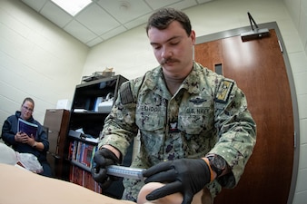 *Training* Hospital Corpsman Third Class Alexander Eshoo treats a simulated patient experiencing respiratory failure as Amanda Heath, a Fire Inspector and Emergency Medical Technician-Advanced, observes his performance during the testing portion of an Emergency Medical Technician-Basic course hosted by the MCAS Cherry Point Fire and Emergency Services Department on March 11, 2026.  Eshoo and other Sailors assigned to Navy Medicine Readiness and Training Command Cherry Point participated in the training to enhance their skills and knowledge in providing emergency medical care in various scenarios.