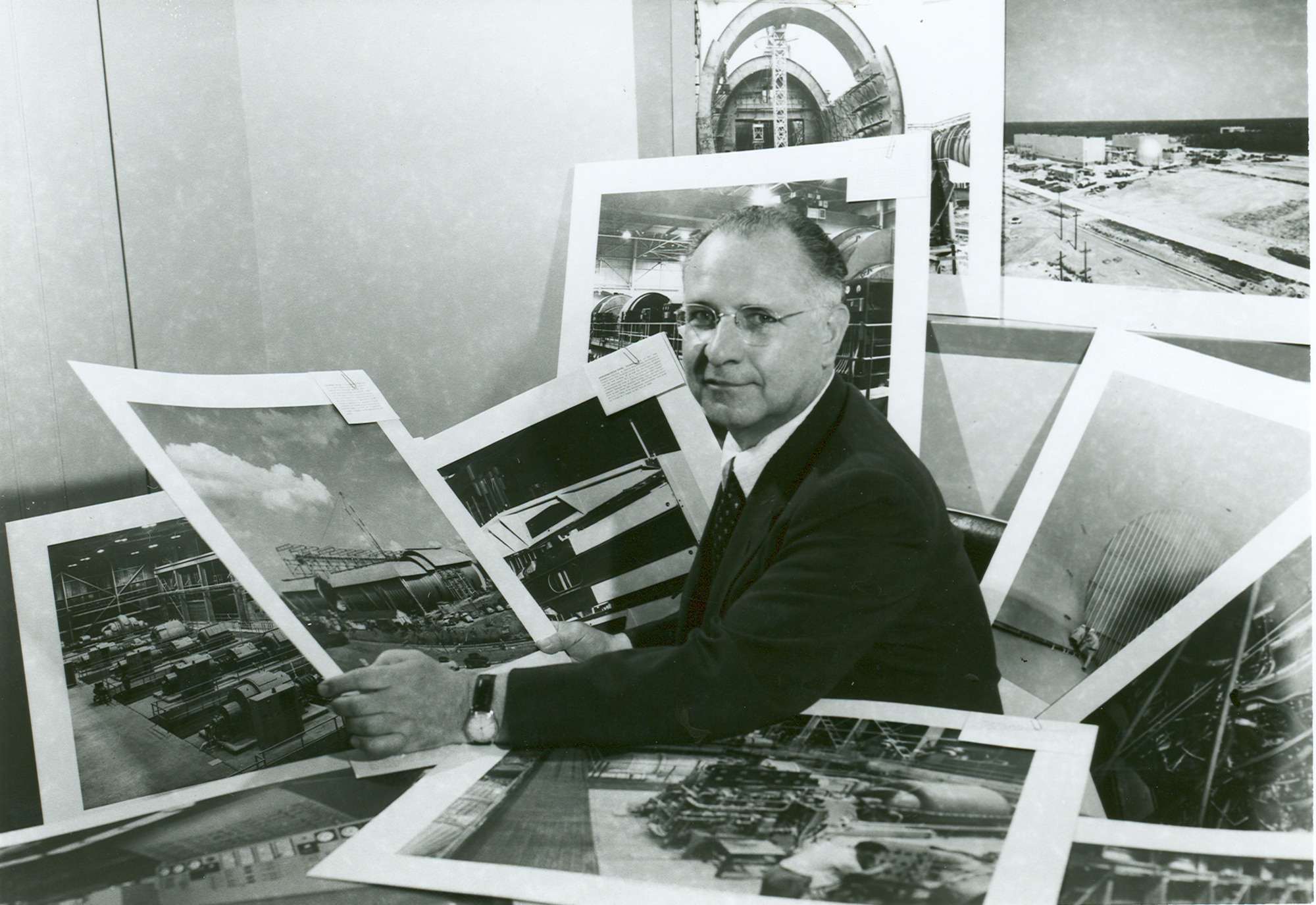 American scientist Frank Wattendorf surrounded by Arnold Engineering Development Complex construction photographs. Wattendorf was a member of the Scientific Advisory Group formed by Theodore von Kármán at the request of Gen. Henry “Hap” Arnold, the commanding general of the U.S. Army Air Forces during World War II and the U.S. Air Force’s only five-star general. The group visited Germany in May 1945 to survey testing and research facilities there. The group would later present these findings and their recommendations for future U.S. aeronautical research and development in a report entitled Toward New Horizons. Prior to this, Wattendorf penned his own report, known as the Trans-Atlantic Memo, to Brig. Gen. Franklin O. Carroll, then commander of Wright Field’s engineering division. Wattendorf’s memo became the first recommendation for a site such as AEDC. (U.S. Air Force photo)