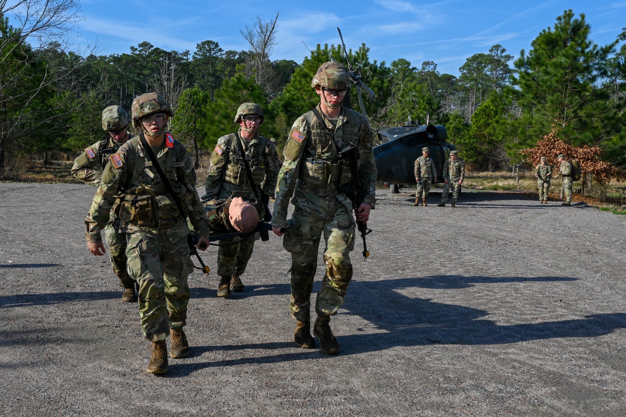 Soldiers carry a training dummy in a stretcher. (U.S. Air Force photo by Airman 1st Class Donnell Ramsey)