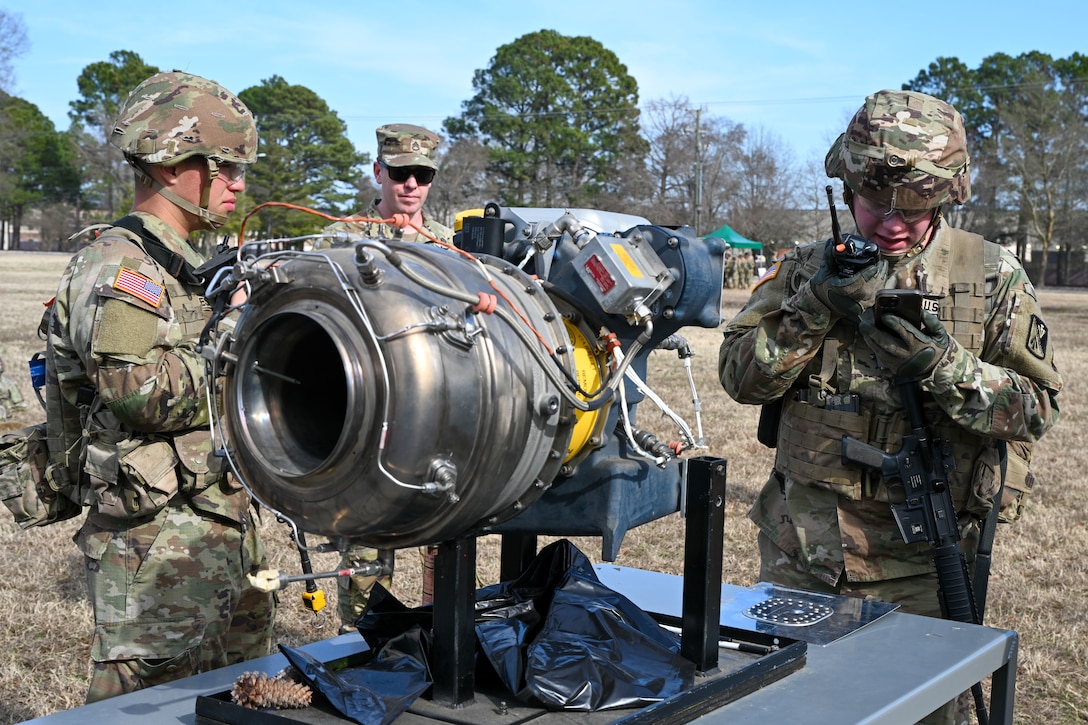 Soldier uses a radio. (U.S. Air Force photo by Airman 1st Class Donnell Ramsey)