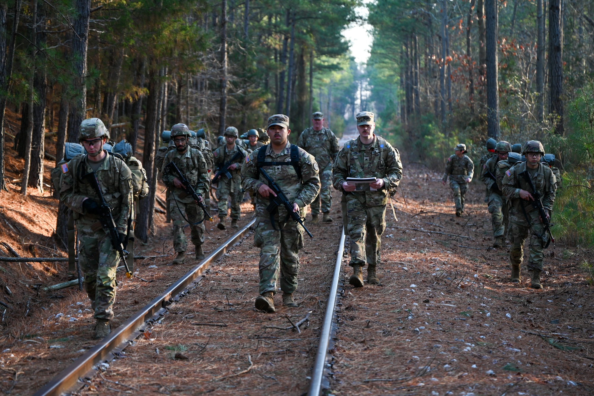 Soldiers ruck along train track. (U.S. Air Force photo by Airman 1st Class Donnell Ramsey)