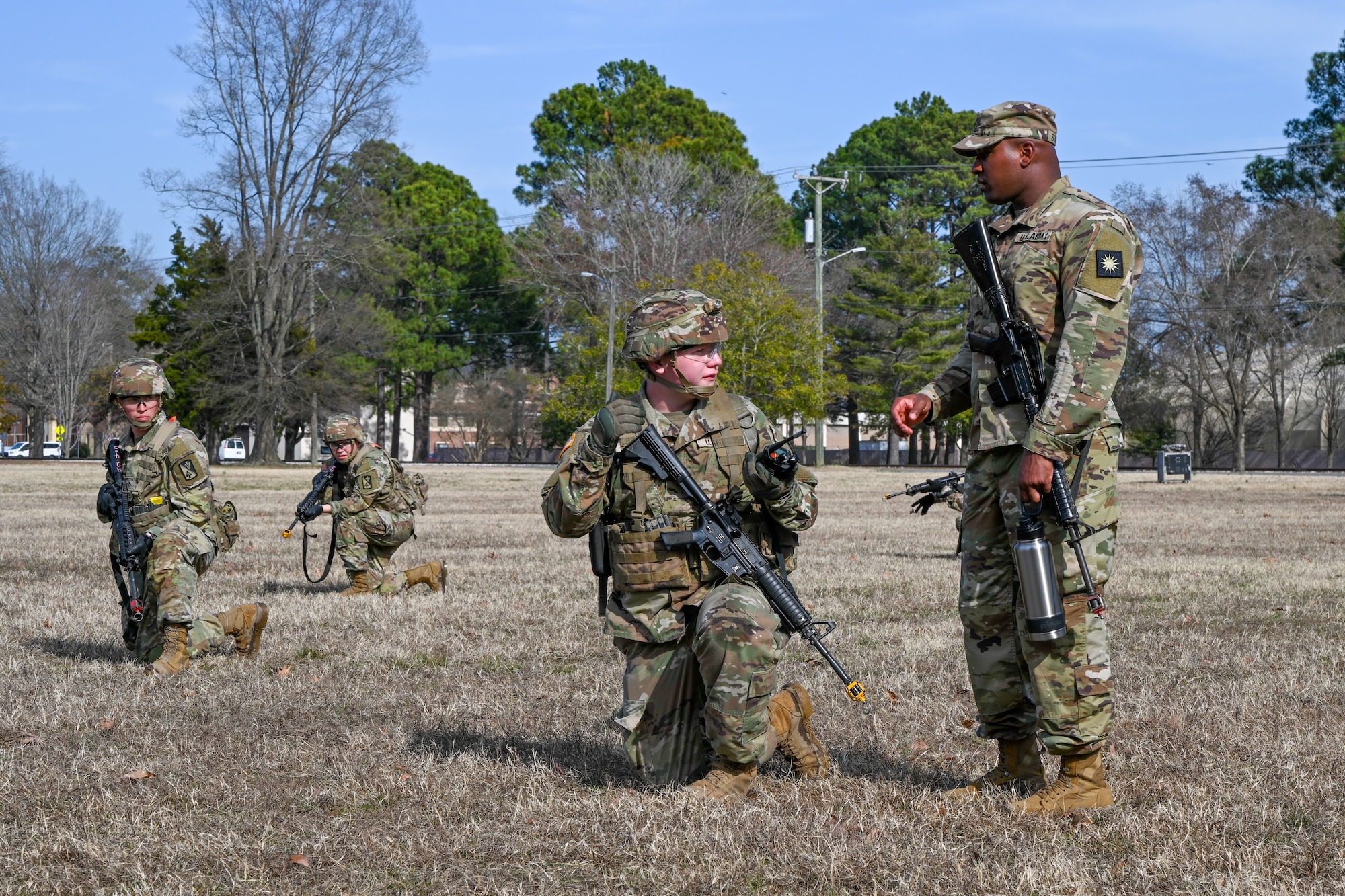 Soldiers kneel in formation. (U.S. Air Force photo by Airman 1st Class Donnell Ramsey)
