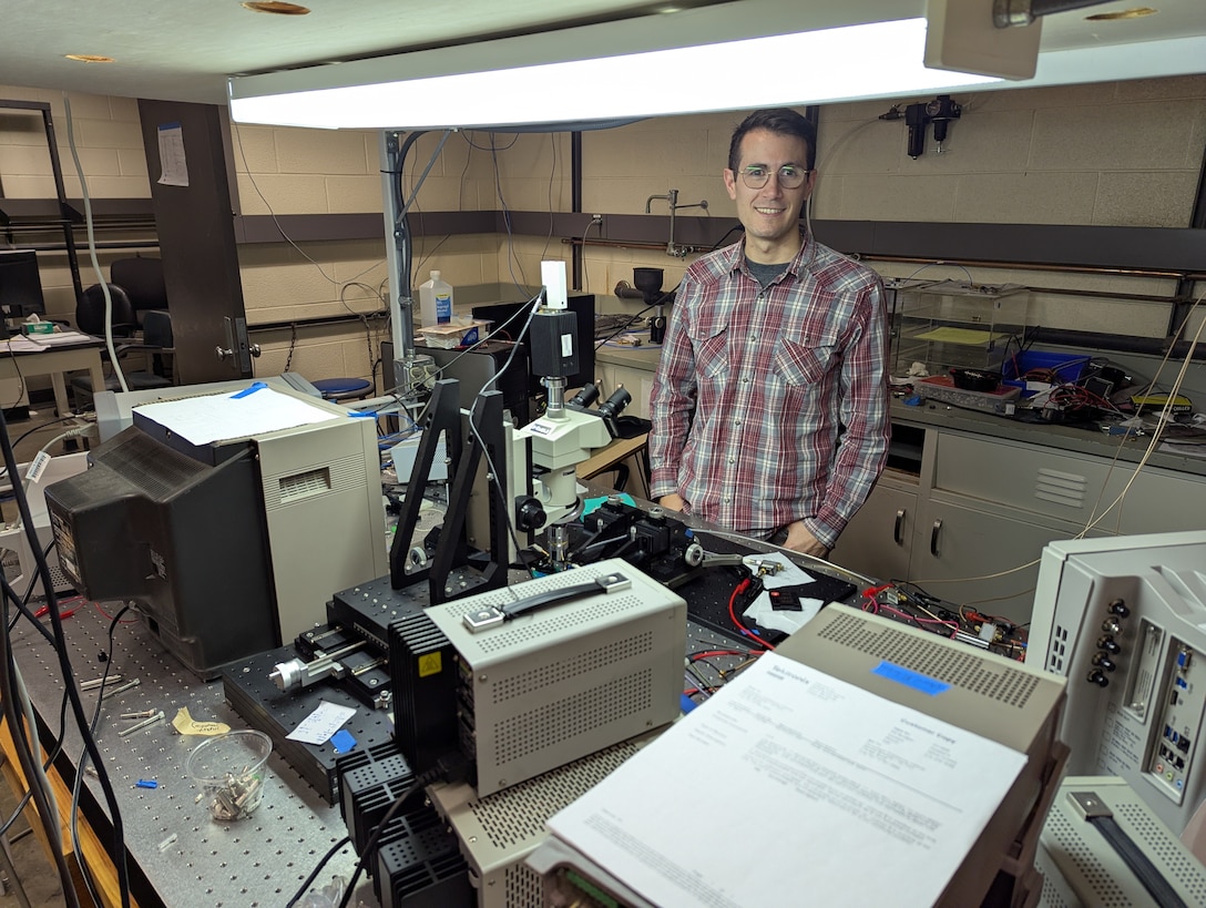 Photo of Nick Gangi, an RPI student and SMART scholar, working on OPERA.