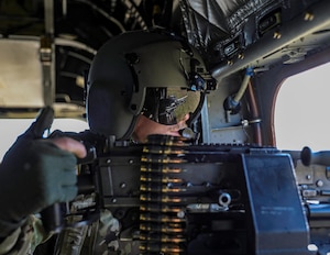 101st Combat Aviation Brigade Soldiers conduct aerial gunnery tables from the new rear cabin windows in the Block II CH-47F at Fort Knox, Ky.