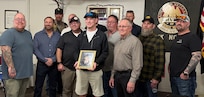 Veterans of 3rd Battalion, 123rd Field Artillery Regiment gather with Andrew Kash, son of Spc. Benjamin Kash, during a remembrance event at the Waltonville, Illinois, Veterans of Foreign Wars Post 9153 March 14.