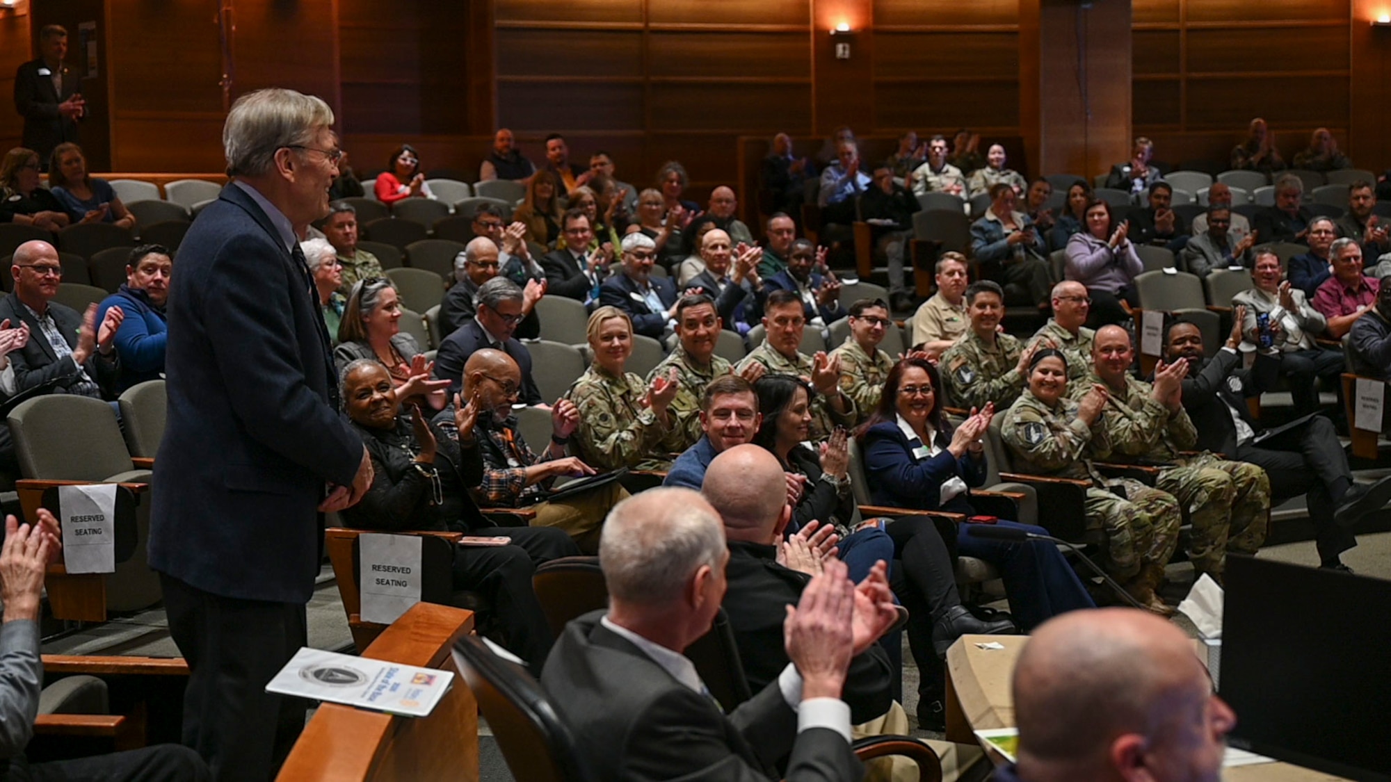 Retired U.S. Air Force Lt. Col. George Peck receives recognition during the annual State of the Base event in Aurora, Colorado, March 12, 2026.