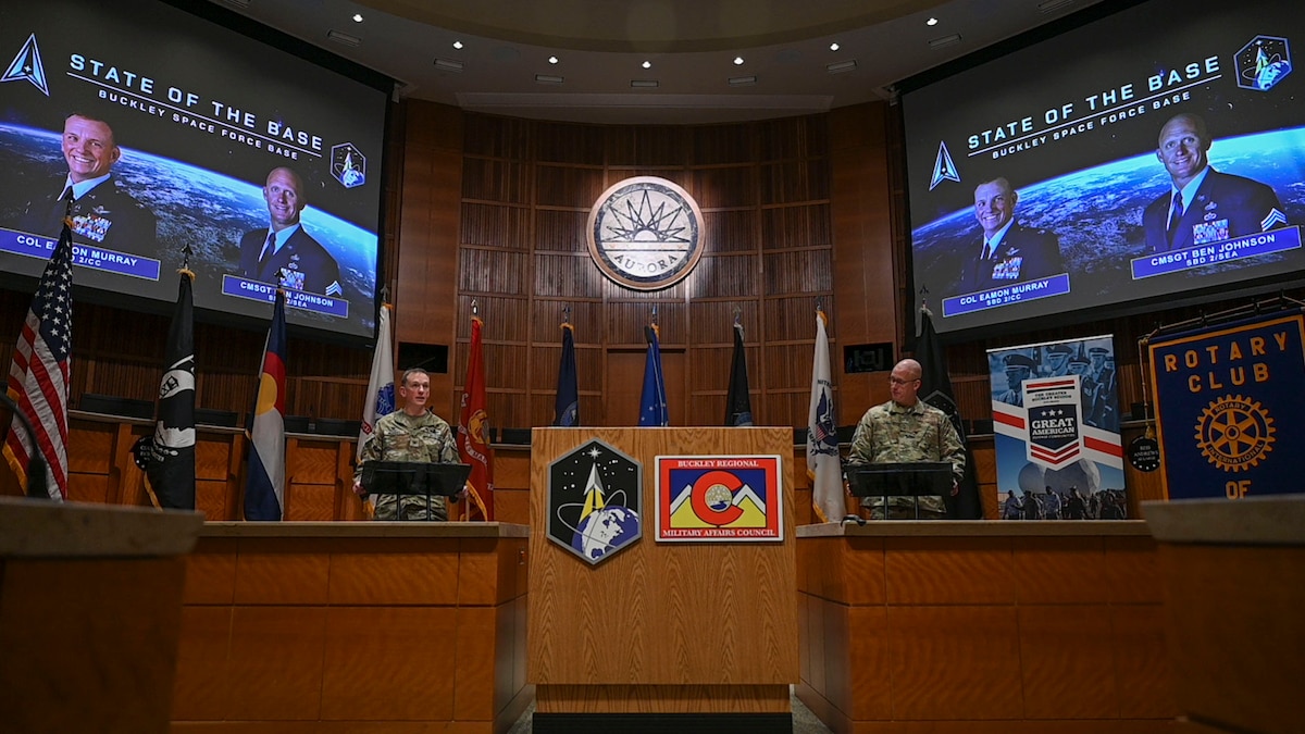 U.S. Space Force Col. Eamon Murray, Space Base Delta 2 commander, and U.S. Air Force Chief Master Sgt. Benjamin Johnson, SBD 2 senior enlisted airman, briefs attendees during the annual State of the Base address in Aurora, Colorado, March 12, 2026.