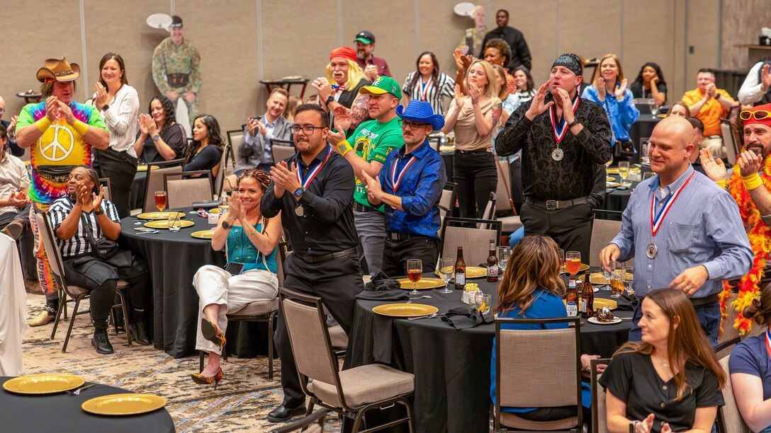 Attendees cheer as award recipients are recognized during the 2025 Annual Awards Banquet in Wichita Falls, Texas, Feb. 27, 2026.