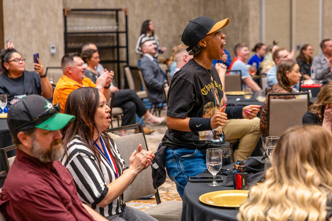 Dianna Grady, 82nd Comptroller Squadron unit program coordinator, cheers during a wrestling exhibition held during the intermission of the 2025 Annual Awards Banquet in Wichita Falls, Texas, Feb. 27, 2026.