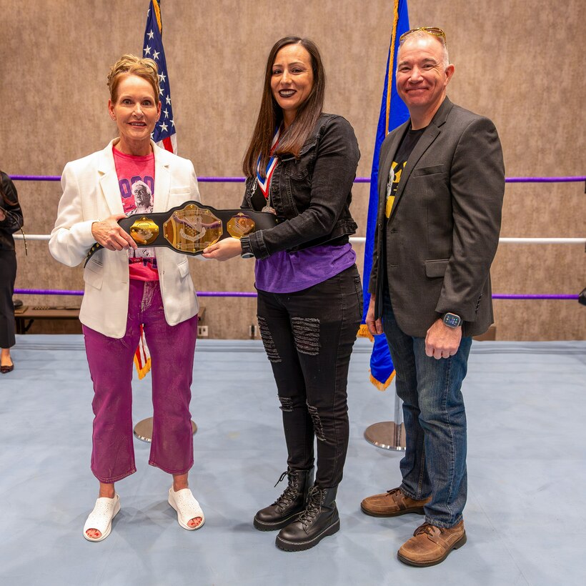 U.S. Air Force Master Sgt. Stephanie Hubbard, 366th Training Squadron, Detachment 6, first sergeant, receives the First Sergeant of the Year Award from U.S. Air Force Col. Kellie Courtland, left, 82nd Training Wing deputy commander, and U.S. Air Force Chief Master Sgt. Rey Schultz, right, 82nd TRW command chief, during the 2025 Annual Awards Banquet in Wichita Falls, Texas, Feb. 27, 2026.