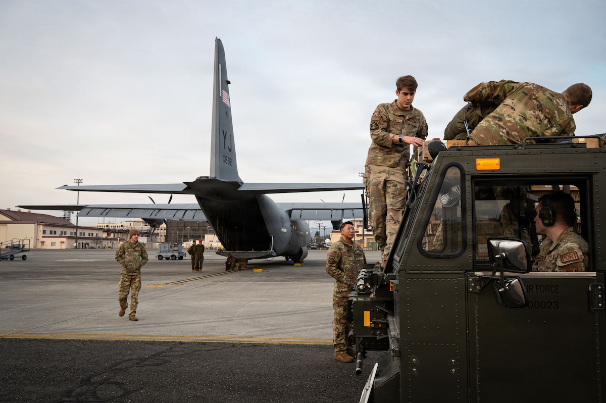 Airmen prepare to load cargo