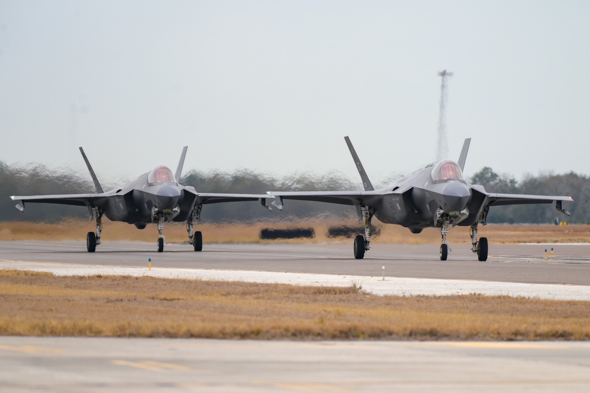 A photo of two aircraft taxiing.