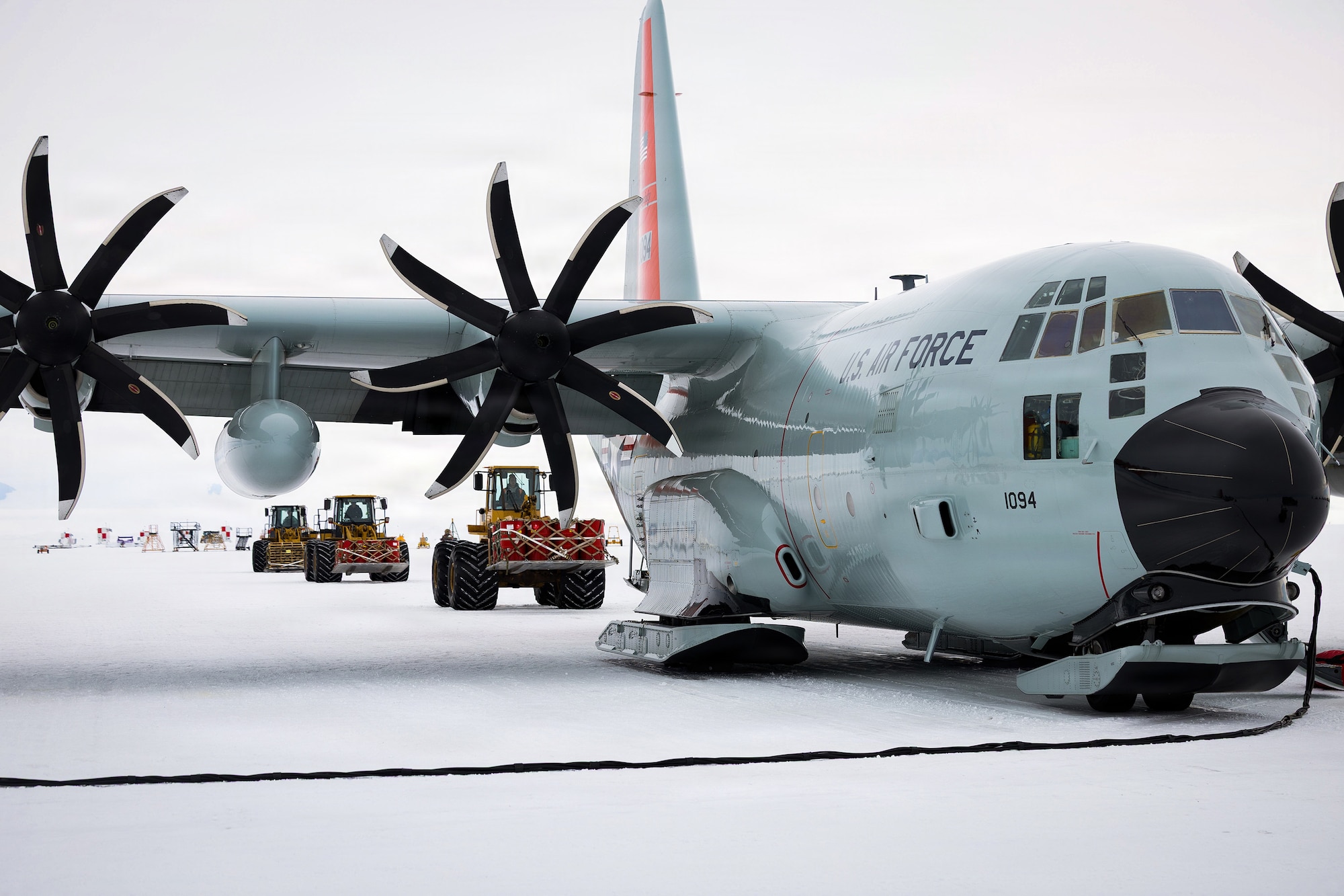 A LC-130 Hercules from the 109th Airlift Wing is loaded with cargo at Williams Field, Antarctica, Dec. 22, 2025.
