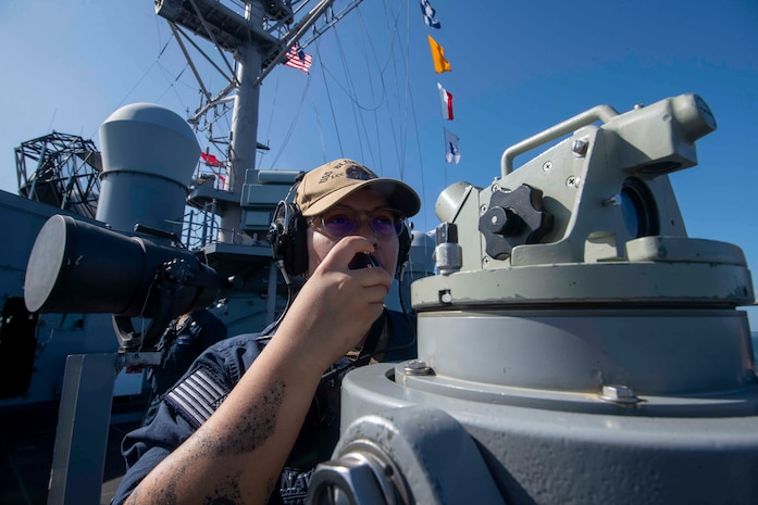 Quartermaster 2nd Class Soledh Rivera uses a sound-powered telephone aboard U.S. 7th Fleet flagship USS Blue Ridge (LCC 19) as the ship prepares to enter port in Manila, Philippines, March 16, 2026.
