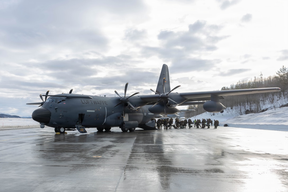 U.S. Marines with 2nd Battalion, 6th Marine Regiment, 2nd Marine Division, board a C-130 aircraft with the German-French Binational Air Transport Squadron (BATS) at Bardufoss Airport, Norway, March 11, 2026. The participation of the German-French BATS highlighted the importance of allied integration and showcased the rapid deployment capabilities of combined NATO forces. A key component of NATO's enhanced vigilance activity Arctic Sentry, exercise Cold Response 26 is a Norwegian-led winter military exercise designed to enhance collective defense capabilities and ensure U.S. readiness to rapidly deploy and seamlessly operate alongside NATO Allies in challenging arctic conditions. (U.S. Marine Corps photo by Cpl. Mya Seymour)
