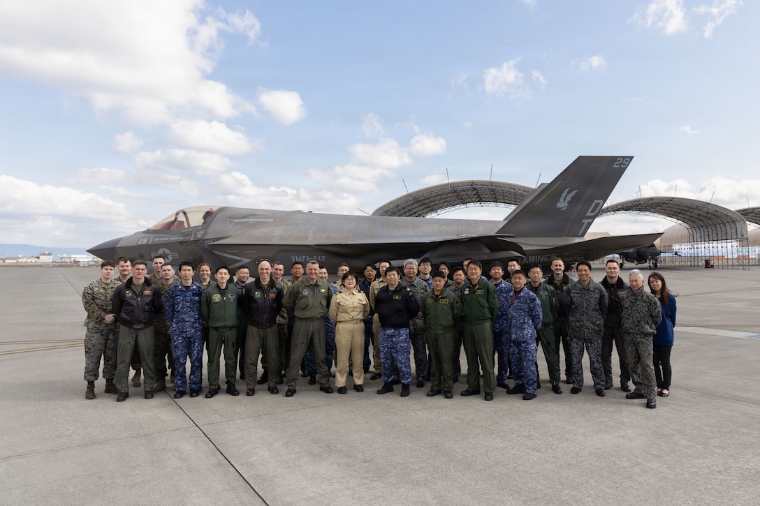 U.S. service members and members of Japan Self-Defense Force pose for a photo in front of an F-35B Lightning II, on Marine Corps Air Station Iwakuni, Yamaguchi, Japan, March 13, 2026. U.S. service members and members of JSDF attended a two-day planning conference, further strengthening U.S.-Japan bilateral cooperation and friendship. (U.S. Marine Corps photo by Cpl. Cecilia Campbell)
