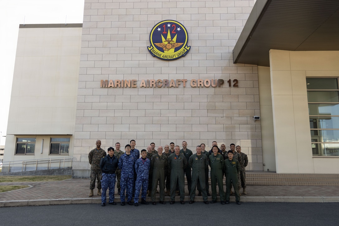 U.S. service members and members of Japan Self-Defense Force pose for a photo outside of Marine Aircraft Group 12 headquarters, on Marine Corps Air Station Iwakuni, Yamaguchi, Japan, March 12, 2026. U.S. service members and members of JSDF attended a two-day planning conference, further strengthening U.S.-Japan bilateral cooperation and friendship. (U.S. Marine Corps photo by Cpl. Cecilia Campbell)