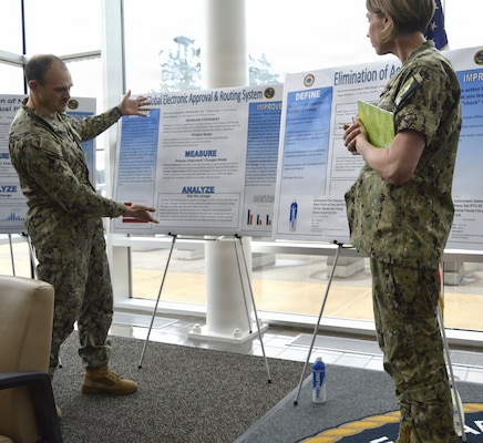 There were 15 participants – including Lt. Justin Roelofs and team members Lt. Sarah Begley and HM2 Rebekah Feltman presenting ‘Global Electronic Approval and Routing System’ at the annual Naval Hospital Bremerton Continuous Process Improvement Fair held March 12, 2026. Mission readiness support, environmental stewardship, patient-care improvement and more were on display at the fair which provided staff members the opportunity to share valuable input and ideas to improve current processes not only at NHB but throughout the Military Health System (Official Navy photo by Douglas H Stutz, NHB/NMRTC Bremerton public affairs officer).
