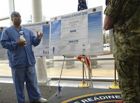 There were 15 participants – including Hospital Corpsman 1st Class Domenick Llanda project lead from Surgery and Main Operating Room representing team members Lt. Cmdr. Kellie Haney, Chief Logistics Specialist Steve Gardiner, HM2 Victoria Perez and other Main OR Sailors at the annual Naval Hospital Bremerton Continuous Process Improvement Fair held March 12, 2026. Mission readiness support, environmental stewardship, patient-care improvement and more were on display at the fair which provided staff members the opportunity to share valuable input and ideas to improve current processes not only at NHB but throughout the Military Health System (Official Navy photo by Douglas H Stutz, NHB/NMRTC Bremerton public affairs officer).