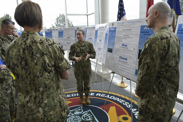 There were 15 participants – including Lt. Hana Omodt of the command Informatics Steering Committee representing team members Lt. Christopher Gunderson, Mr. Kelly Gann, Mr. Chris Rona and Mr. Adam Richard, who presented ‘MHS GENESIS Account Request Process, at the annual Naval Hospital Bremerton Continuous Process Improvement Fair held March 12, 2026. Mission readiness support, environmental stewardship, patient-care improvement and more were on display at the fair which provided staff members the opportunity to share valuable input and ideas to improve current processes not only at NHB but throughout the Military Health System (Official Navy photo by Douglas H Stutz, NHB/NMRTC Bremerton public affairs officer).