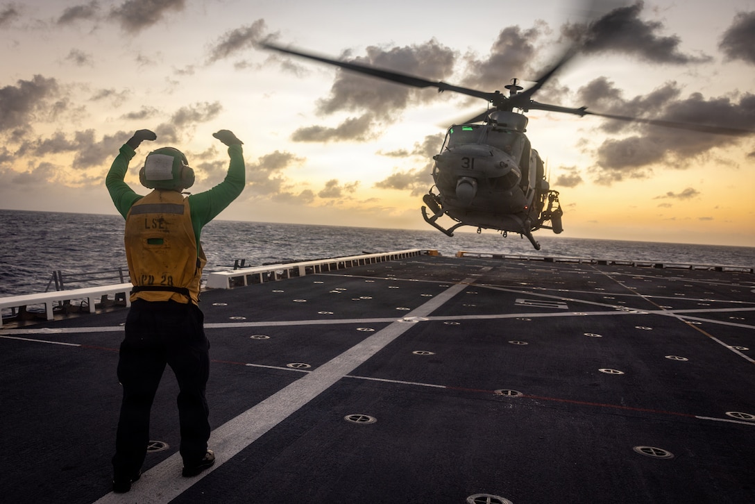 A U.S. Marine Corps UH-1Y Venom helicopter with Marine Medium Tiltrotor Squadron (VMM) 263 (Reinforced), 22nd Marine Expeditionary Unit (Special Operations Capable), takes off during a night aerial sniper live-fire aboard San Antonio-class amphibious transport dock USS Fort Lauderdale (LPD 28) while underway in the Caribbean Sea, March 6, 2026. U.S. military forces are deployed to the Caribbean in support of the U.S. Southern Command mission, Department of War-directed operations, and the president's priorities to disrupt illicit drug trafficking and protect the homeland. (U.S. Marine Corps photo)