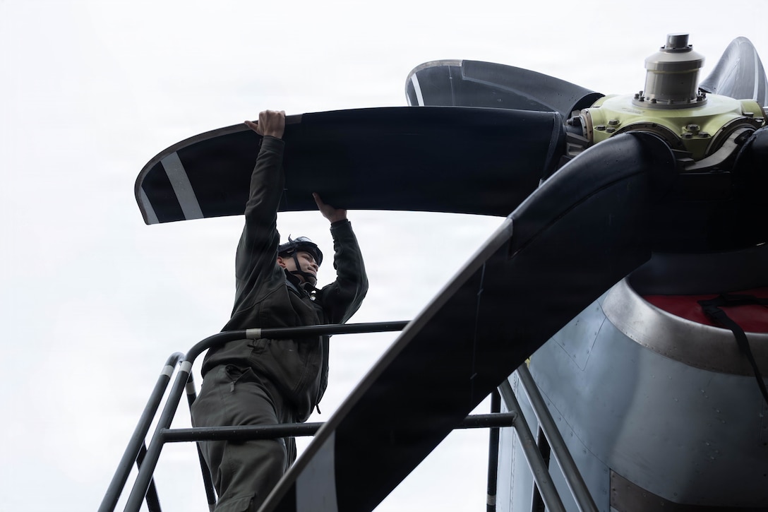 U.S. Marine Corps Cpl. Christian Concepcion, a powerline mechanic with Marine Aerial Refueler Transport Squadron (VMGR) 252, Marine Aircraft Group 14, 2nd Marine Aircraft Wing, changes the propeller on a KC-130J Super Hercules aircraft at Rygge Air Base, Norway, March 14, 2026. VMGR-252 maintained the aircraft between flight operations during exercise Cold Response 26. A key component of NATO's enhanced vigilance activity Arctic Sentry, exercise Cold Response 26 is a Norwegian-led winter military exercise designed to enhance collective defense capabilities and ensure U.S. readiness to rapidly deploy and seamlessly operate alongside NATO Allies in challenging arctic conditions. Concepcion is a native of Texas. (U.S. Marine Corps photo by Cpl. Mya Seymour)