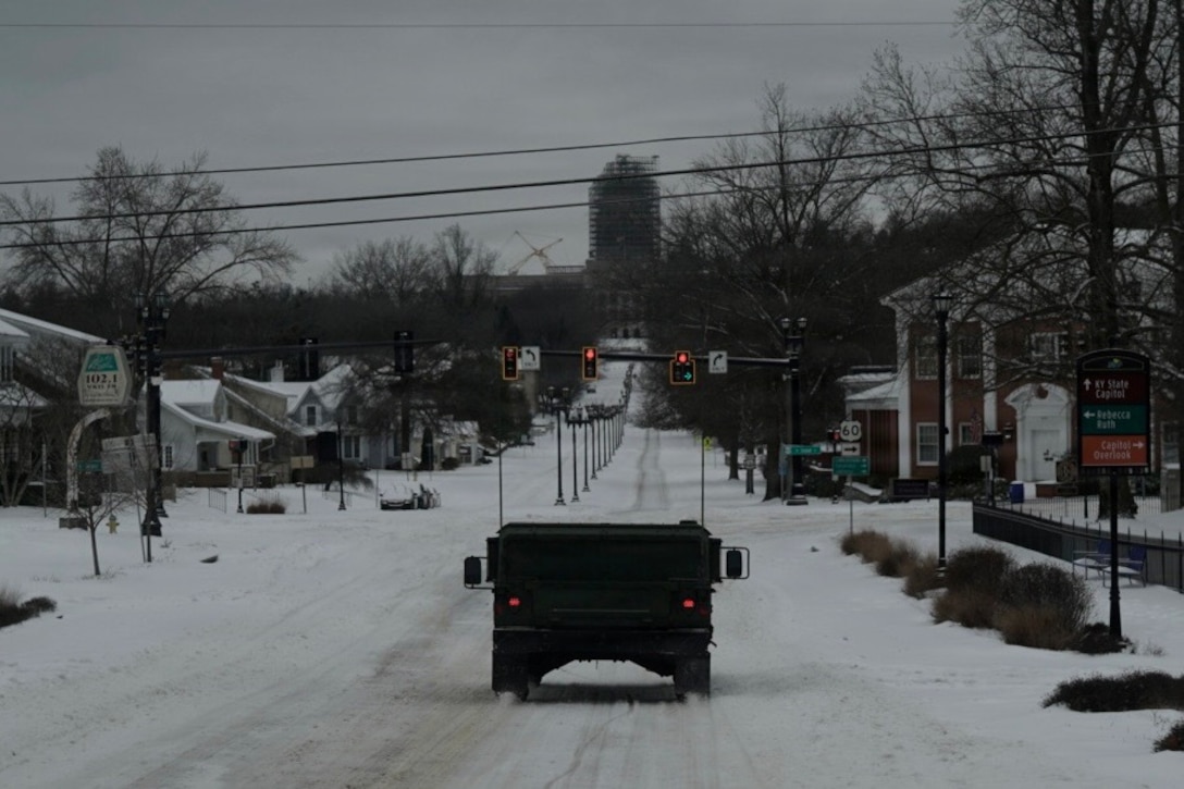 HUMVEEs from the 63rd Theater Aviation Brigade patrol roads around Frankfort, Kentucky, during Winter Storm Fern Jan. 25, 2026.