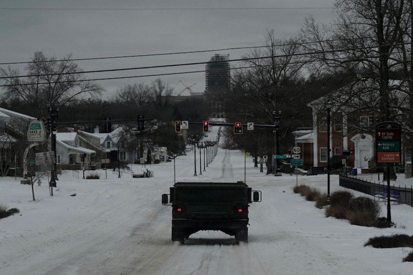 HUMVEEs from the 63rd Theater Aviation Brigade patrol roads around Frankfort, Kentucky, during Winter Storm Fern Jan. 25, 2026.