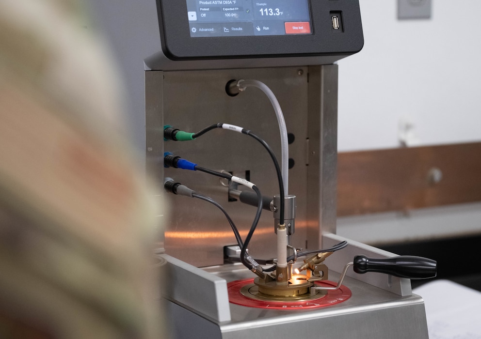 An Optiflash, used in the Fuels Laboratory, is displayed at Altus Air Force Base, Oklahoma, Feb. 25, 2026. The 97th Logistics Readiness Squadron (LRS) showcased the Optiflash to the 97th Air Mobility Wing command team, illustrating how the 97th LRS ensures the fuel being delivered is up to par, while also highlighting their innovative approach and critical role in maintaining safe and efficient operations of the 97th Air Mobility Wing. (U.S. Air Force photo by Airman 1st Class Emma Wright)