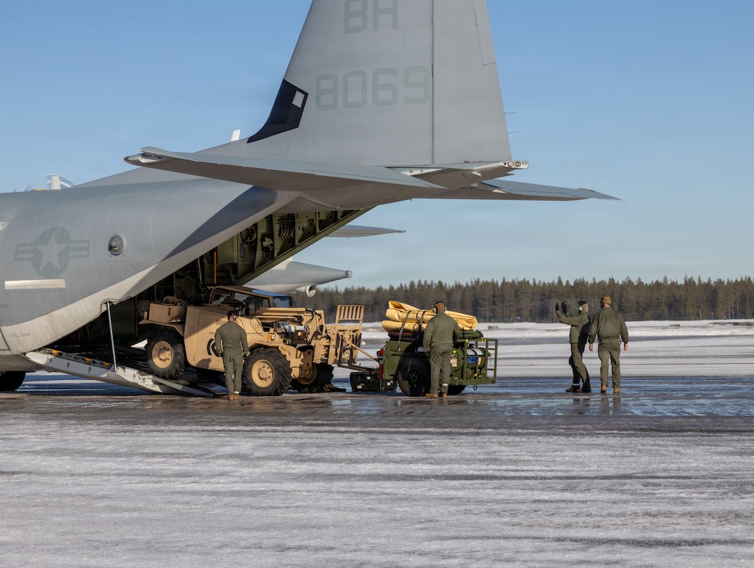 U.S. Marines with Marine Aerial Refueler Transport Squadron (VMGR) 252, Marine Aircraft Group 14, 2nd Marine Aircraft Wing, unload gear from a KC-130J Super Hercules aircraft at Kallax Air Base, Luleå, Sweden, March 11, 2026. The VMGR-252 Marines unloaded equipment ahead of establishing a forward arming and refueling point to support air operations during exercise Cold Response 26. A key component of NATO's enhanced vigilance activity Arctic Sentry, exercise Cold Response 26 is a Norwegian-led winter military exercise designed to enhance collective defense capabilities and ensure U.S. readiness to rapidly deploy and seamlessly operate alongside NATO Allies in challenging arctic conditions. (U.S. Marine Corps photo by Lance Cpl. Donovan Pimentel)
