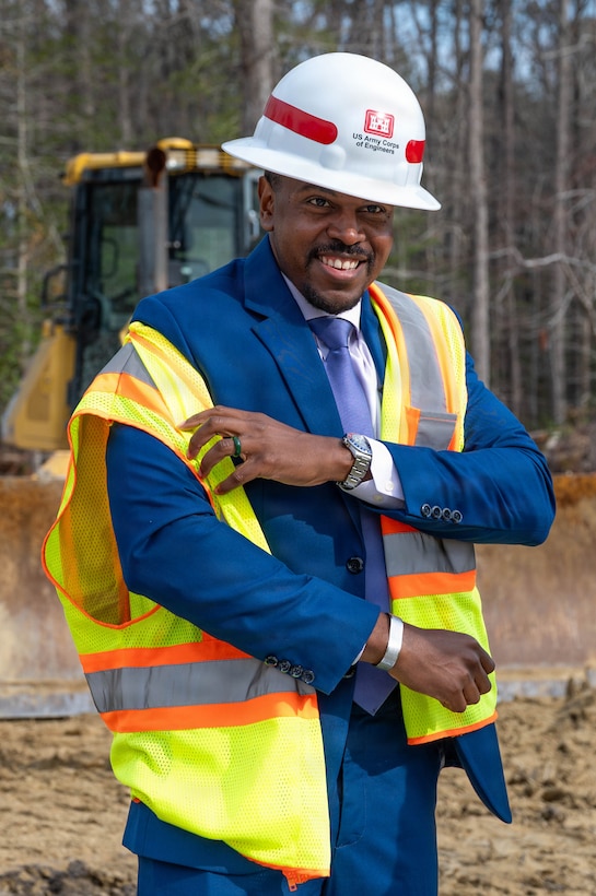Phillip Jones, mayor of Newport News has a hard hat on and it actively putting on a yellow vest.