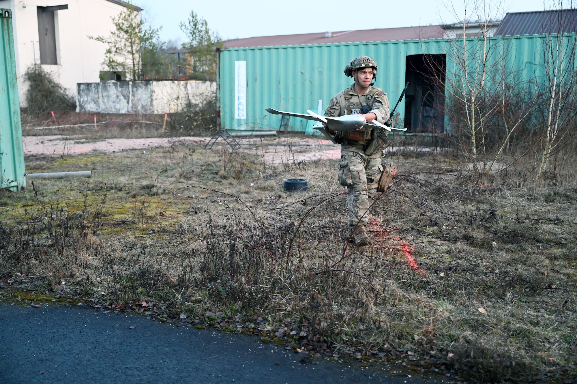 U.S. Air Force Staff Sgt. Yin Pu, 432nd Civil Engineer Squadron, moves a simulated drone during an Explosive Ordnance Disposal exercise during Silver Flag March 10, 2026, at Ramstein Air Base, Germany. Silver Flag covered a wide range of critical skills, including airfield damage repair, response to chemical, biological, radiological, and nuclear threats, lodging operations, and mortuary affairs. This iteration was also the first time the force support career field rejoined their civil engineer and logistics readiness counterparts in three years. (U.S. Air Force photo by Capt. Amber R. Kelly-Herard)