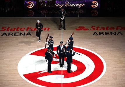 The U.S. Air Force Honor Guard Drill Team performs a weapons drill routine during an NBA halftime show in Atlanta, Ga., March 12, 2026. The Drill Team traveled to Georgia to perform for five high schools, a community event, and during a halftime show for the Atlanta Hawks vs. Brooklyn Nets basketball game to showcase the Air Force’s precision and excellence. (U.S. Air Force photo by Tech. Sgt. Sergio A. Gamboa)