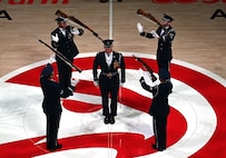 The U.S. Air Force Honor Guard Drill Team performs a weapons drill routine during an NBA halftime show in Atlanta, Ga., March 12, 2026. The Drill Team traveled to Georgia to perform for five high schools, a community event, and during a halftime show for the Atlanta Hawks vs. Brooklyn Nets basketball game to showcase the Air Force’s precision and excellence. (U.S. Air Force photo by Tech. Sgt. Sergio A. Gamboa)